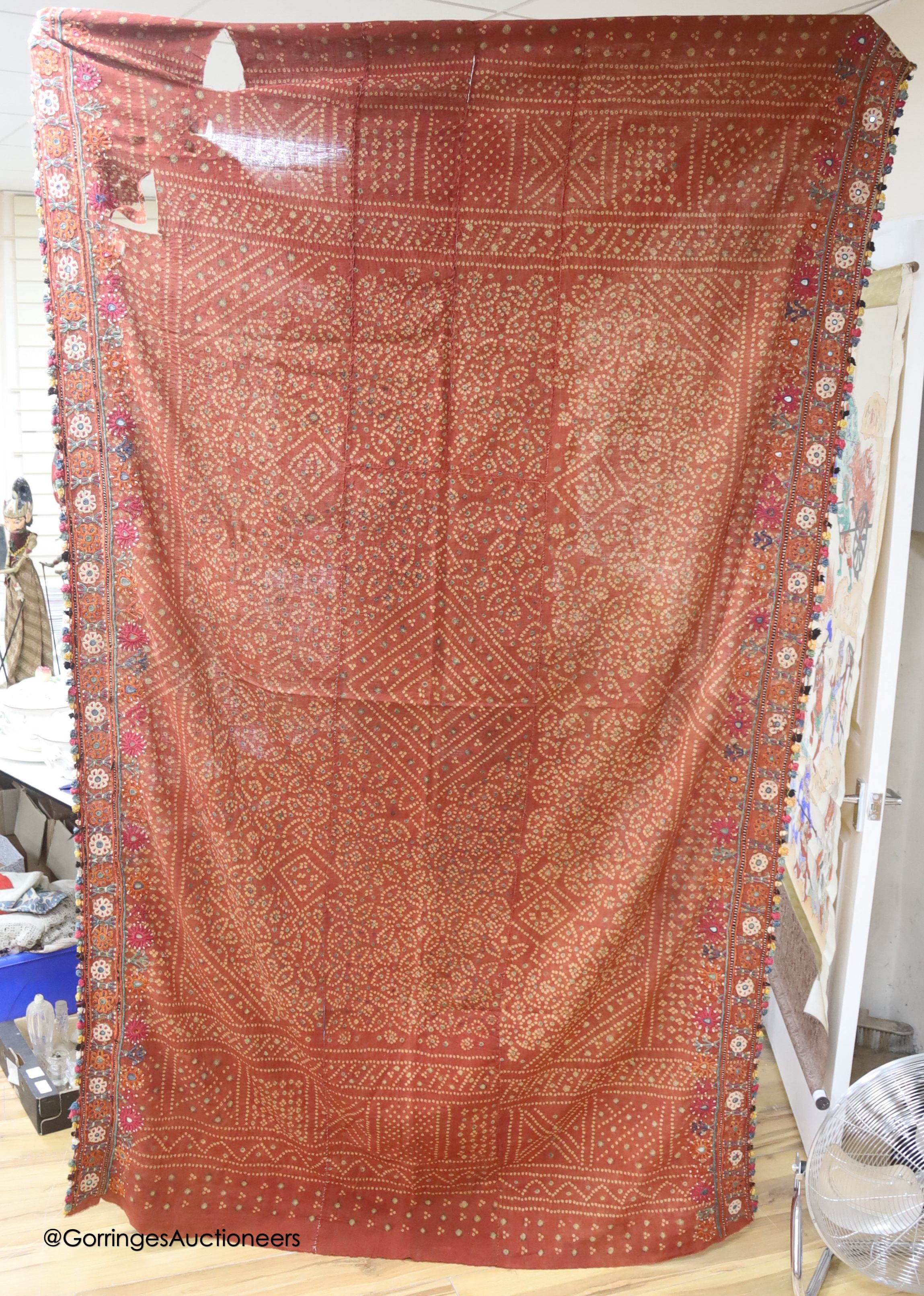 Two Indian mirrored embroidered panels, a gold thread embroidered sari, a chain stitched panel and a woven multicoloured panel